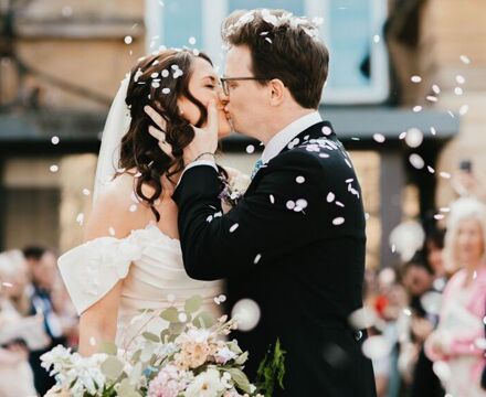 Confetti couple kissing