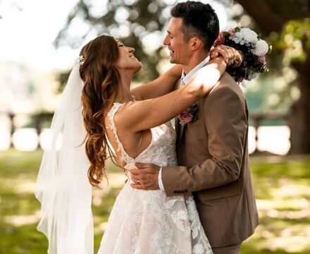 Kelly & Nathan embracing under tree